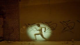 A woman peaking behind a shower courtain